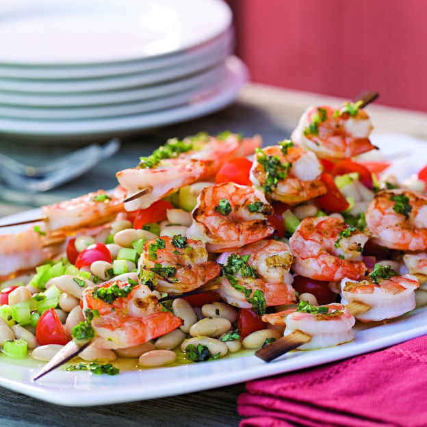 GRILLED SHRIMP SKEWERS OVER WHITE BEAN SALAD